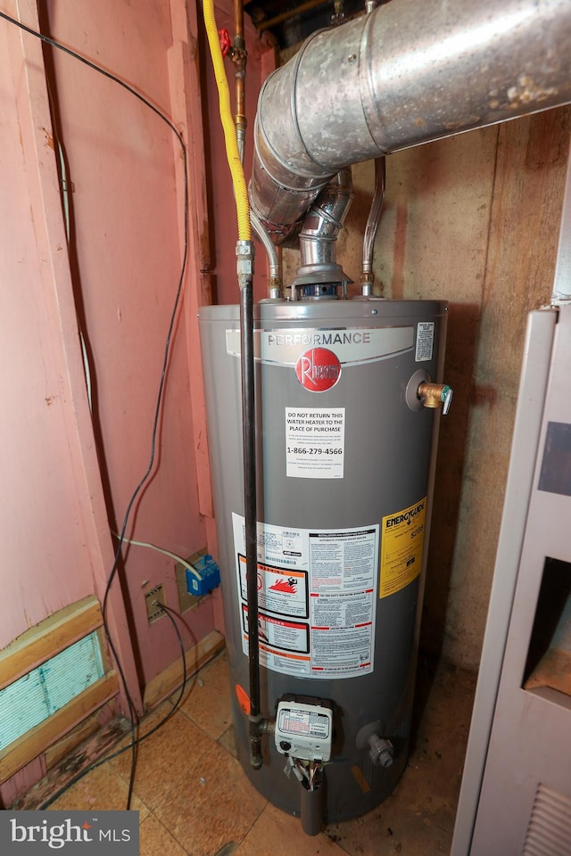 utility room featuring gas water heater