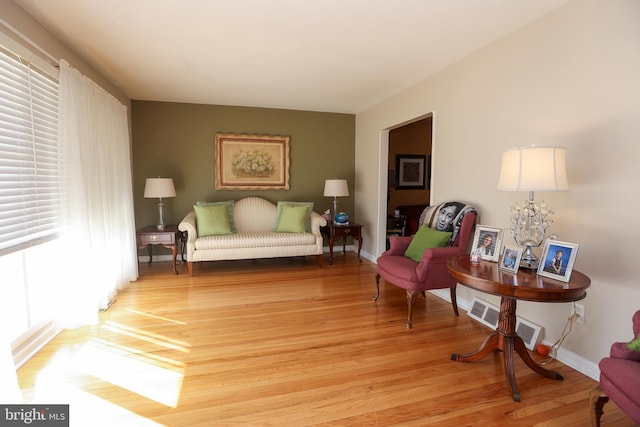 living area with light hardwood / wood-style flooring