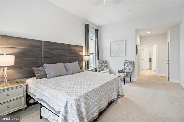 bedroom featuring light colored carpet