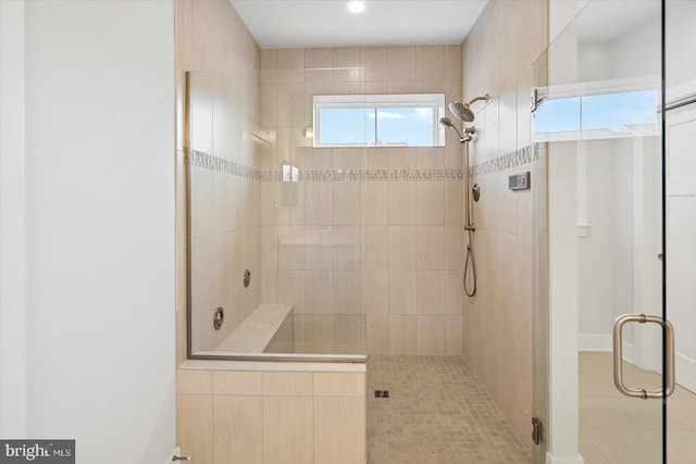 bathroom featuring tile patterned flooring and a shower with door