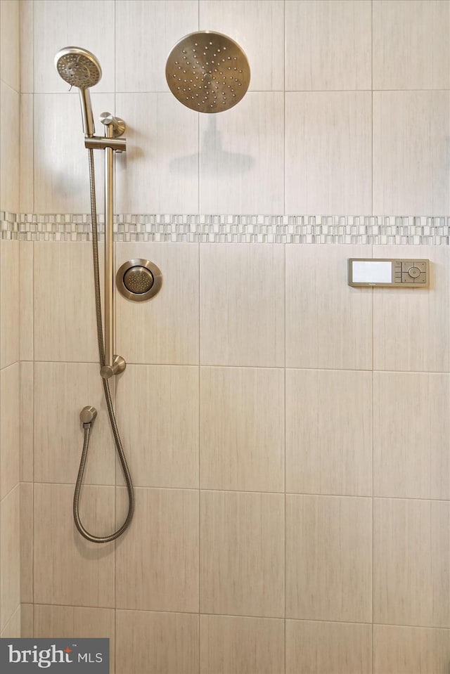 bathroom with a tile shower