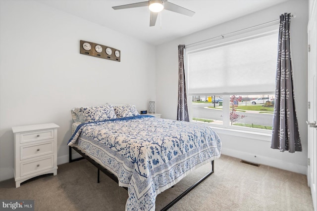 carpeted bedroom with ceiling fan