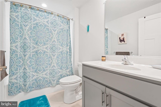 bathroom featuring tile patterned flooring, vanity, and toilet