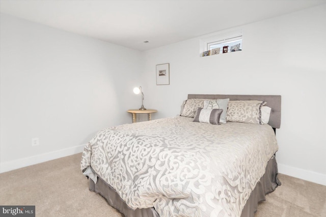 bedroom with light colored carpet