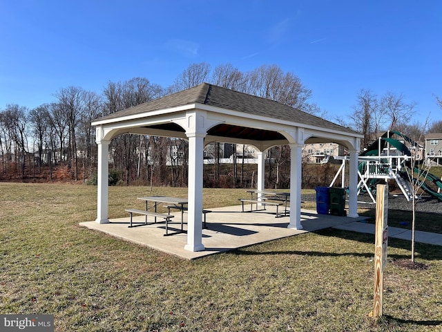 view of home's community featuring a gazebo, a playground, and a lawn