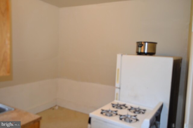 kitchen featuring white stove