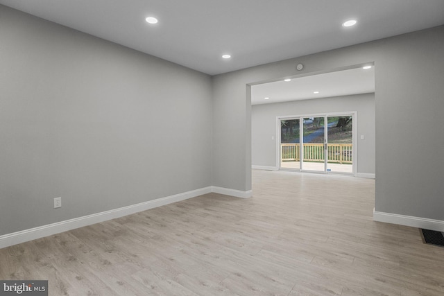 spare room with light wood-type flooring