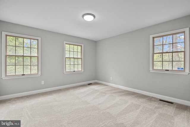 empty room with light colored carpet