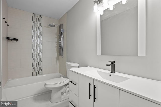 full bathroom featuring vanity, toilet, and tiled shower / bath combo