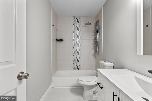 full bathroom with tiled shower / bath, vanity, and toilet