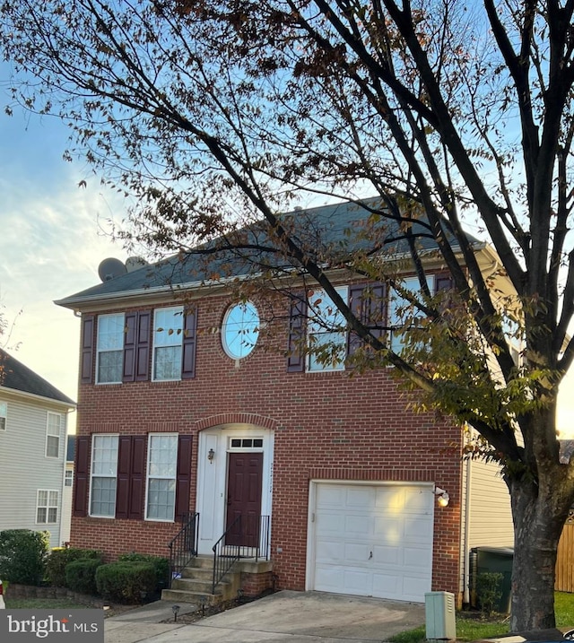 colonial home featuring a garage