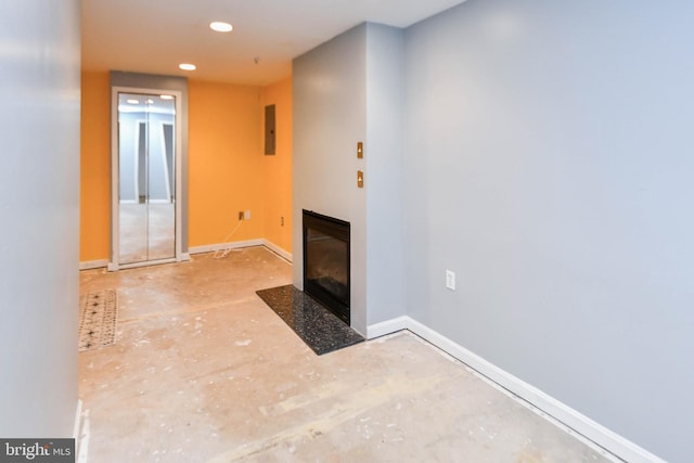 unfurnished living room with electric panel