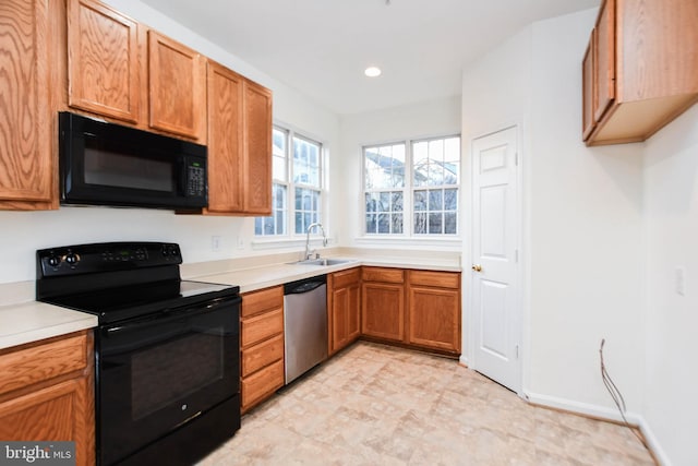 kitchen with sink and black appliances