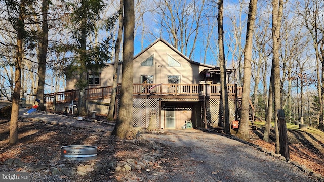 view of front facade with a wooden deck