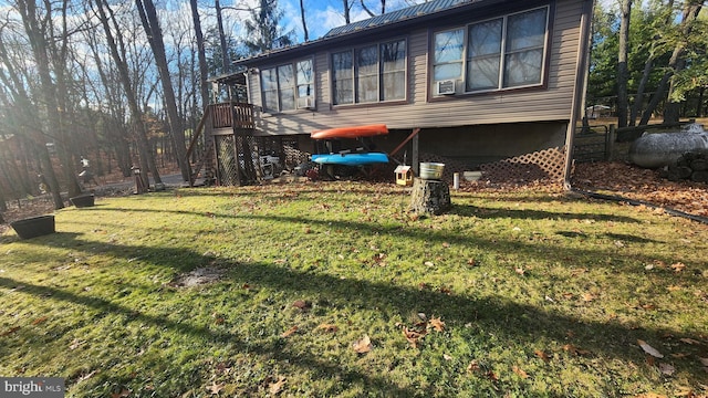 rear view of property with a yard