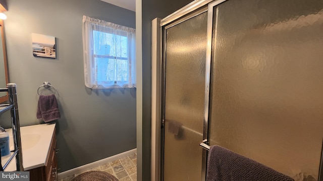 bathroom with vanity and an enclosed shower