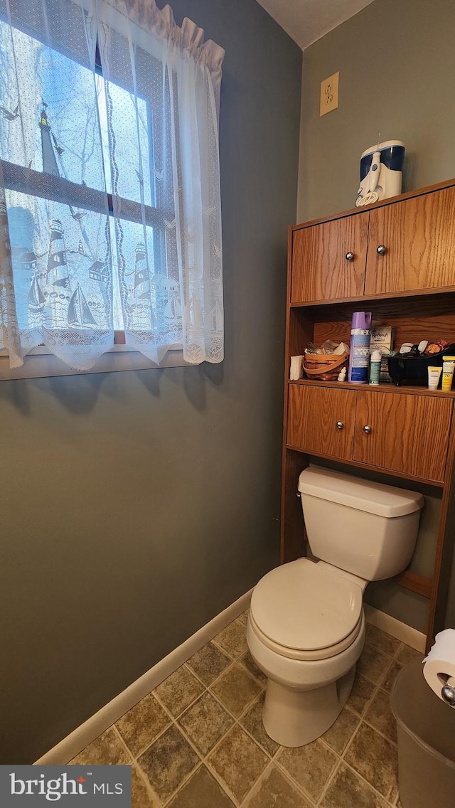 bathroom with tile patterned floors and toilet