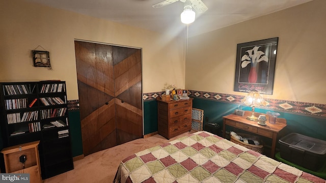 bedroom with light carpet and ceiling fan