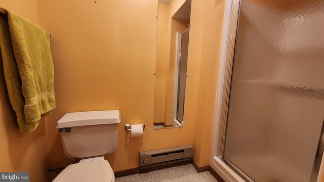 bathroom with baseboard heating, a shower with shower door, and toilet