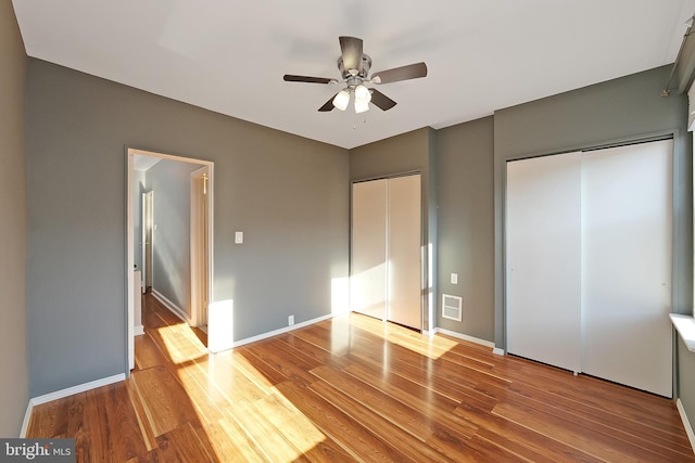 unfurnished bedroom featuring ceiling fan and light hardwood / wood-style floors