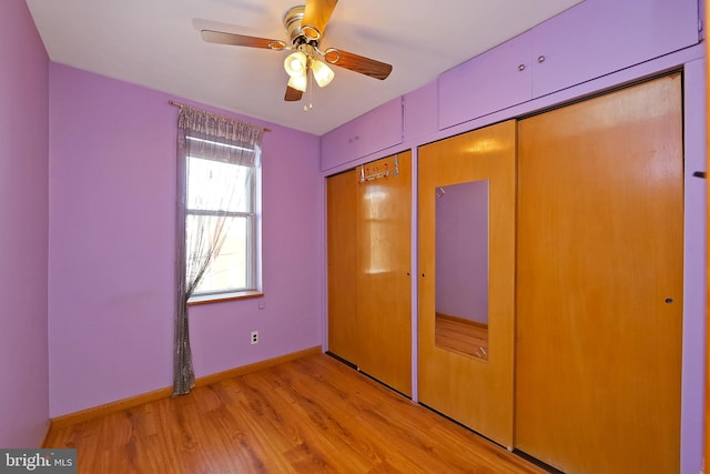 unfurnished bedroom featuring ceiling fan, light wood-type flooring, and a closet