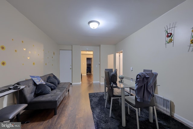 dining space featuring hardwood / wood-style flooring