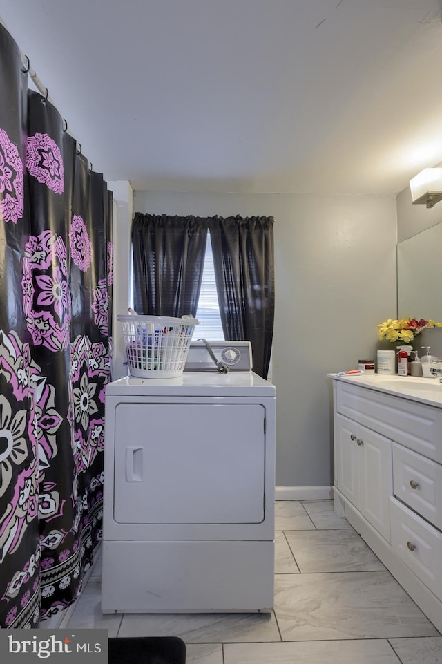 laundry room with washer / clothes dryer and sink