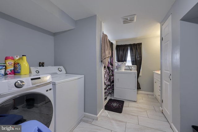 laundry area featuring separate washer and dryer