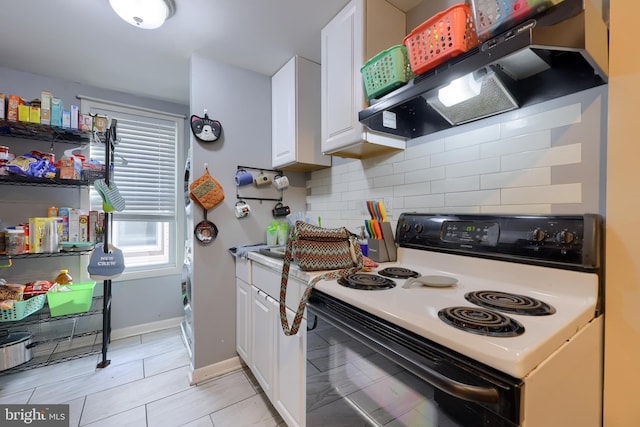 kitchen featuring decorative backsplash, white range with electric stovetop, range hood, white cabinets, and light tile patterned flooring