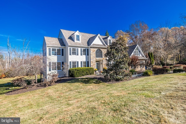 view of front of home with a front lawn