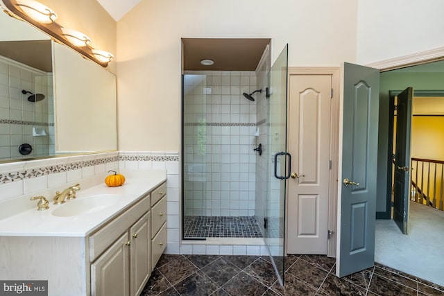 bathroom with vanity and walk in shower