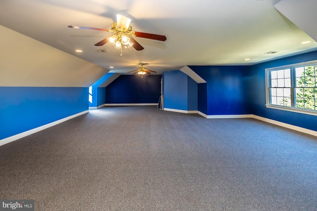 additional living space featuring carpet, ceiling fan, and lofted ceiling