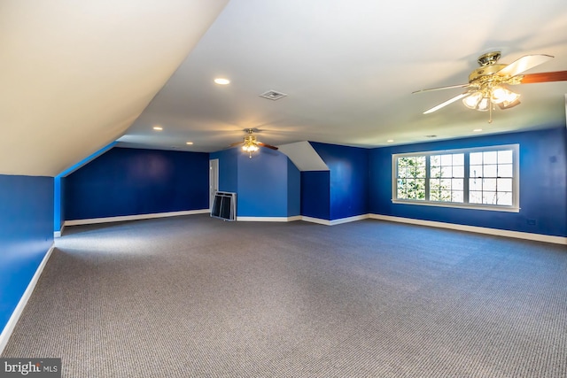 additional living space featuring ceiling fan, carpet floors, and lofted ceiling