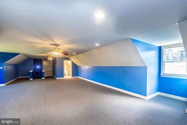 bonus room featuring carpet flooring, vaulted ceiling, and ceiling fan