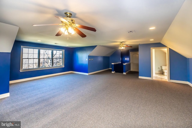 additional living space featuring carpet flooring and ceiling fan