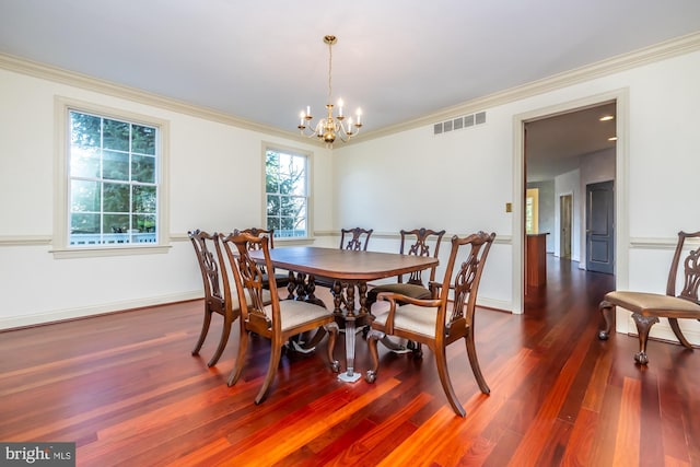 dining space with a notable chandelier, dark hardwood / wood-style floors, and ornamental molding