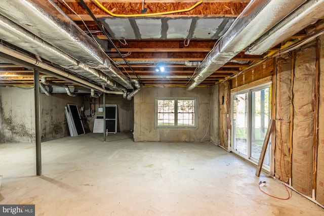 basement featuring electric panel