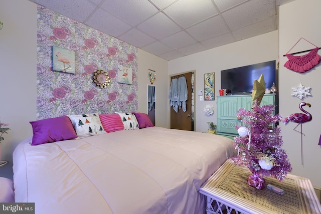 bedroom with a paneled ceiling