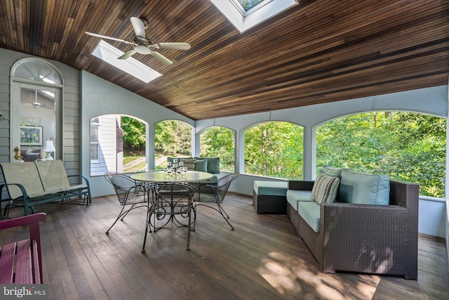 wooden deck with ceiling fan and an outdoor living space