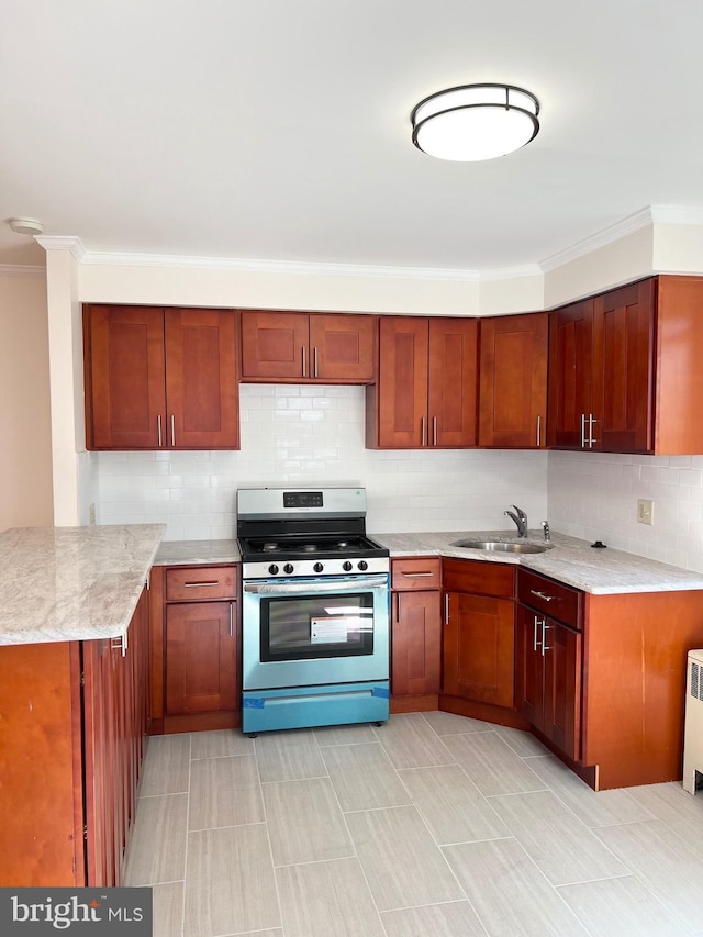 1807 Chandler St, Philadelphia, PA 19111 - kitchen featuring stainless steel stove, a sink, backsplash, ornamental molding, and a peninsula