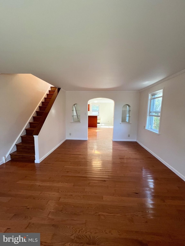 unfurnished living room featuring dark hardwood / wood-style floors