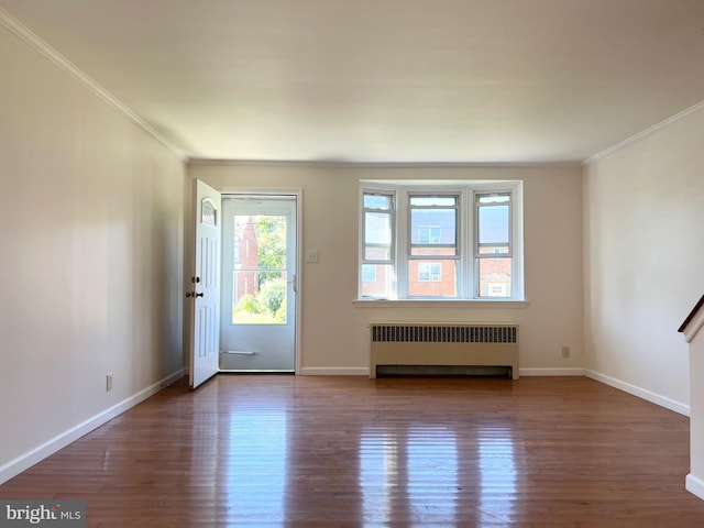1807 Chandler St, Philadelphia, PA 19111 - spare room with radiator heating unit, ornamental molding, wood finished floors, and baseboards