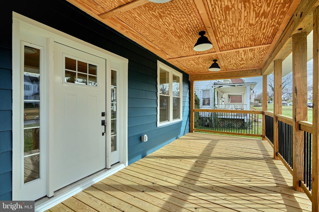 wooden terrace featuring a porch