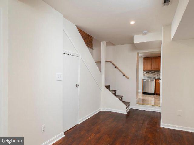 interior space with dark hardwood / wood-style floors