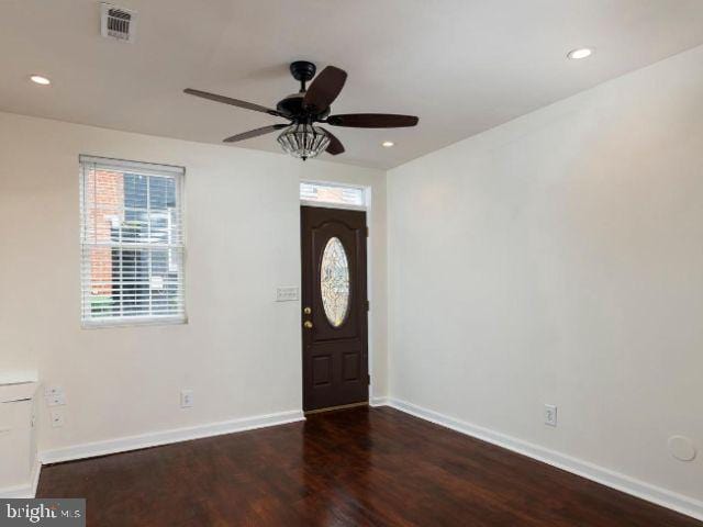 entryway with dark hardwood / wood-style flooring and ceiling fan