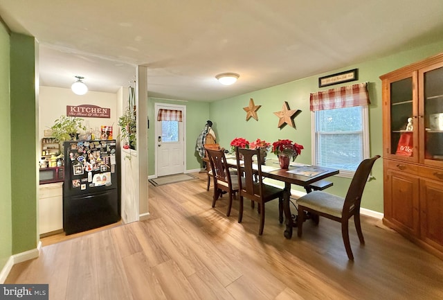 dining area featuring light hardwood / wood-style floors and a wealth of natural light