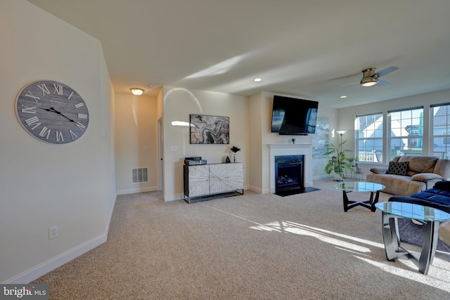 living room with light carpet and ceiling fan