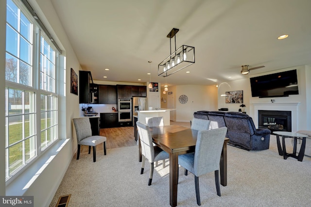 view of carpeted dining space