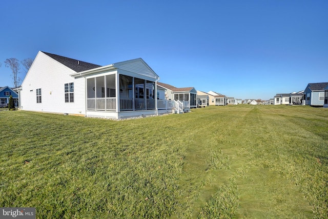 view of yard with a sunroom