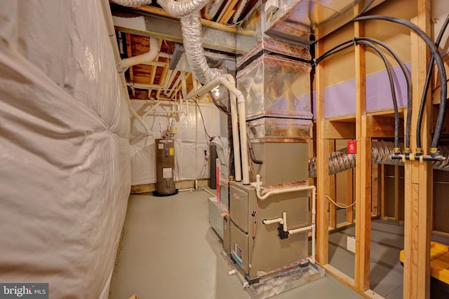 utility room featuring water heater